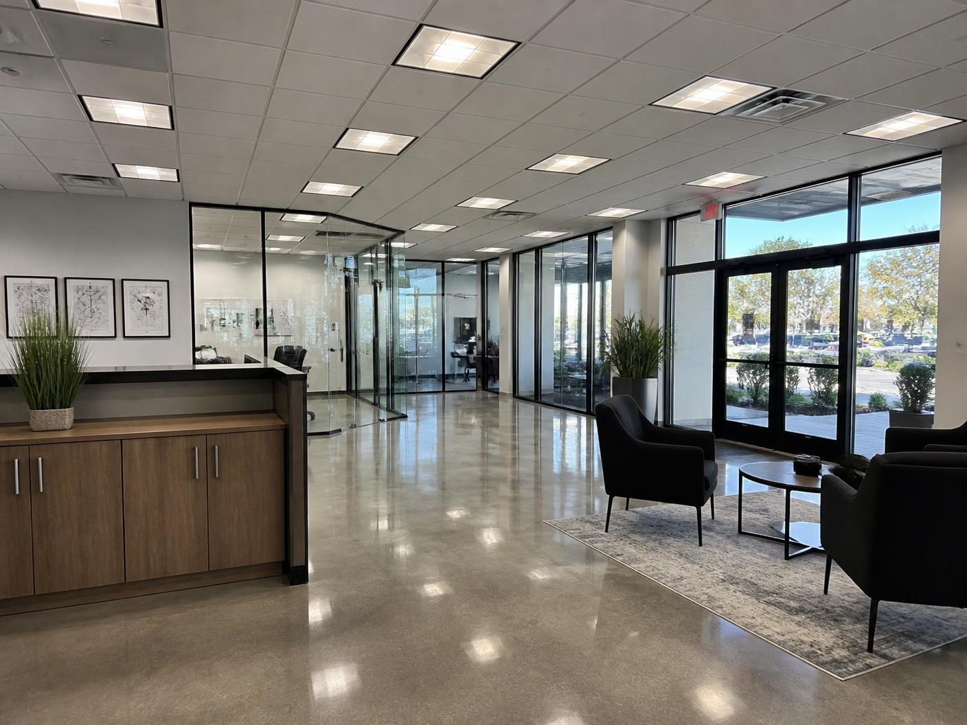Commercial superintendent reviewing plans inside a Boca Raton office build-out under construction
